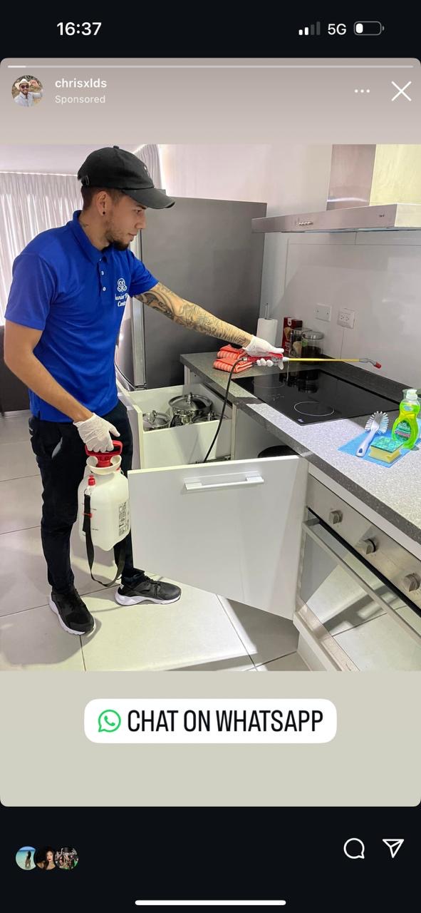 Junior Pest Control technician treating a kitchen in Oranjestad, Aruba